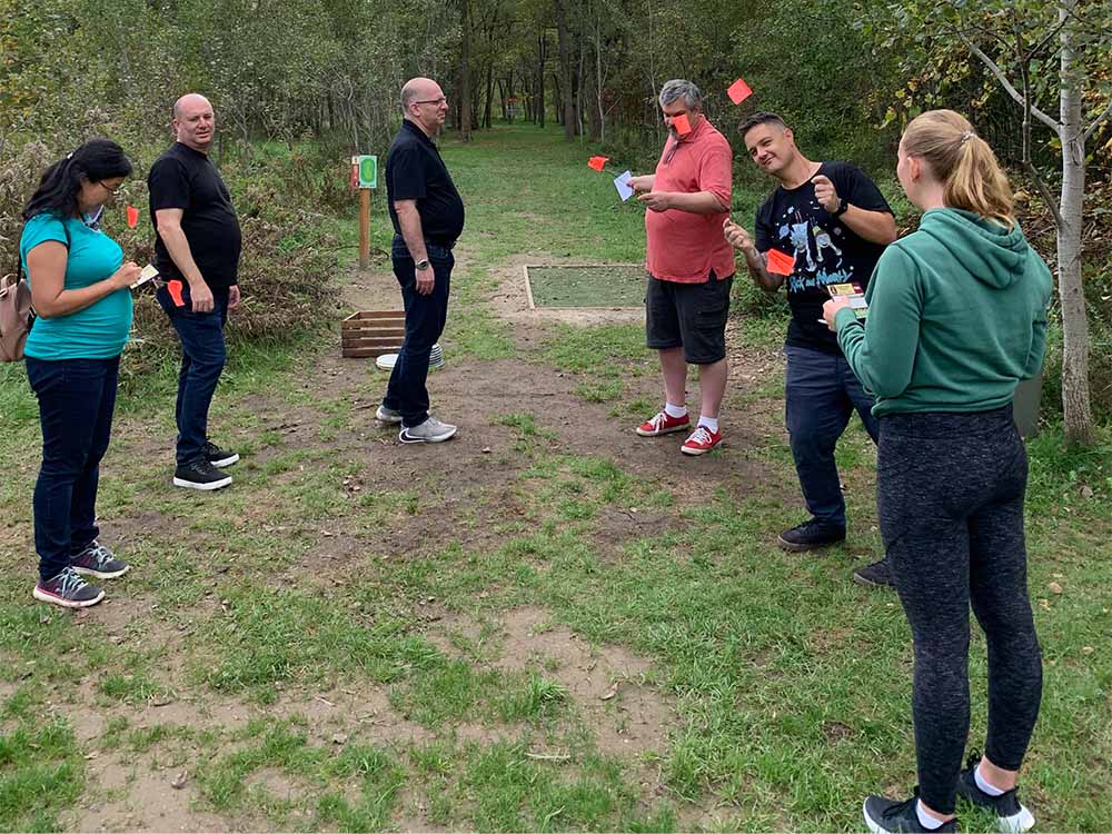 REM team assembled together to start disc golf